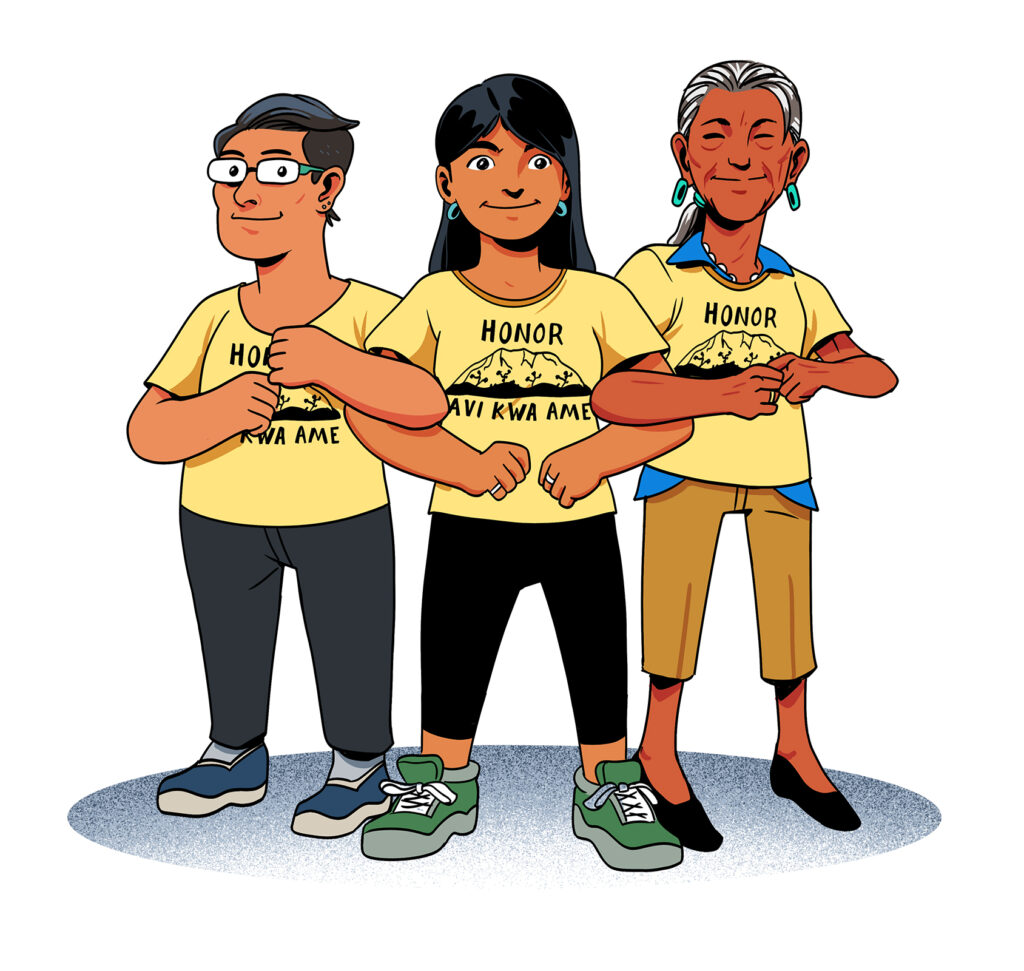 Three indigenous women lock arms. They wear yellow shirts that say "Honor Avi Kwa Ame."